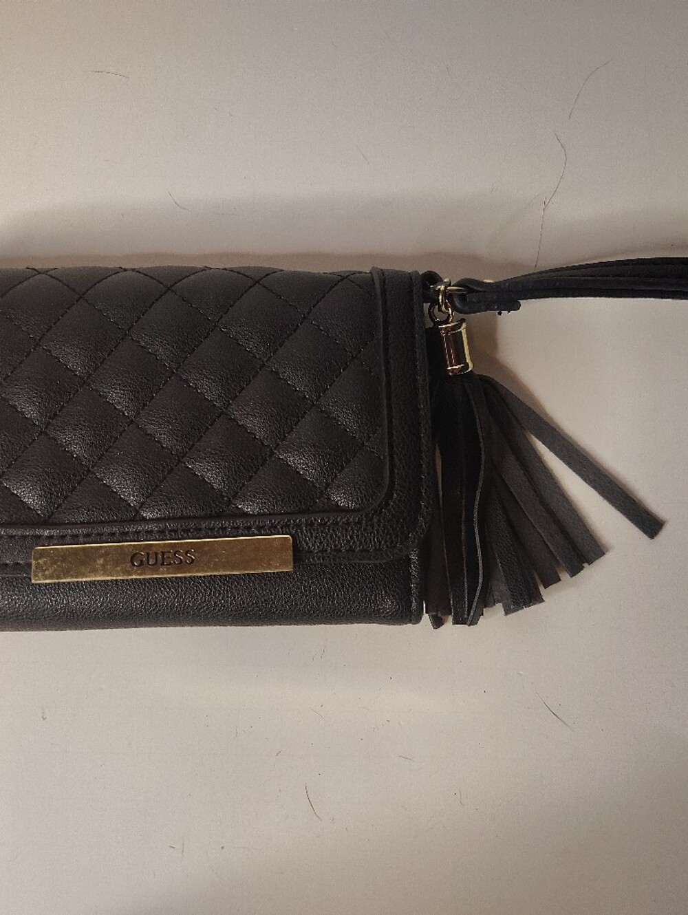GUESS Black Quilted Clutch Wristlet with Tassel and Gold Accent